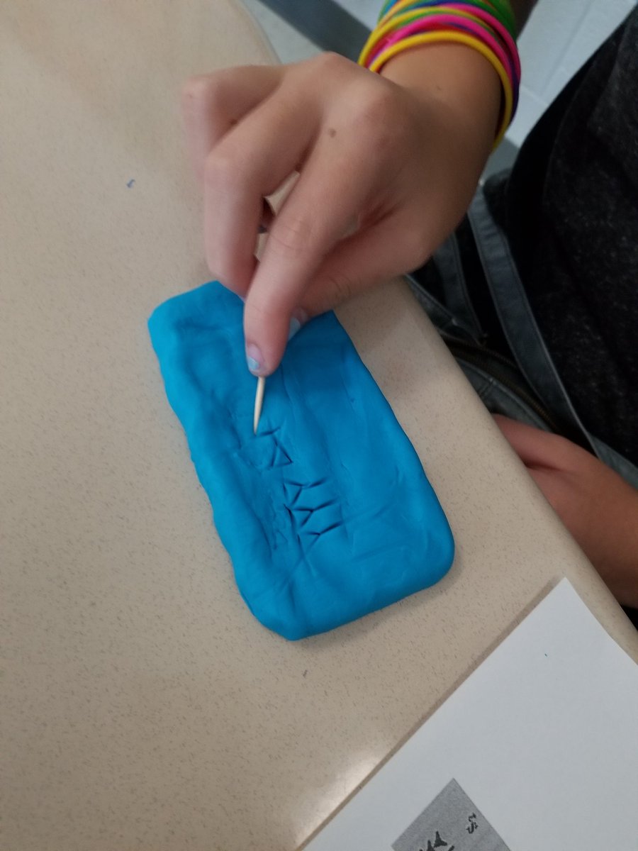 mrsjhowells's tweet photo. Students practiced their cuneiform writing skills using clay and wedge styluses from ancient Mesopotamia (aka Playdoh and toothpicks from Target). #HowellsTeachesHistory #stayWILD https://t.co/73zIjrqAkD