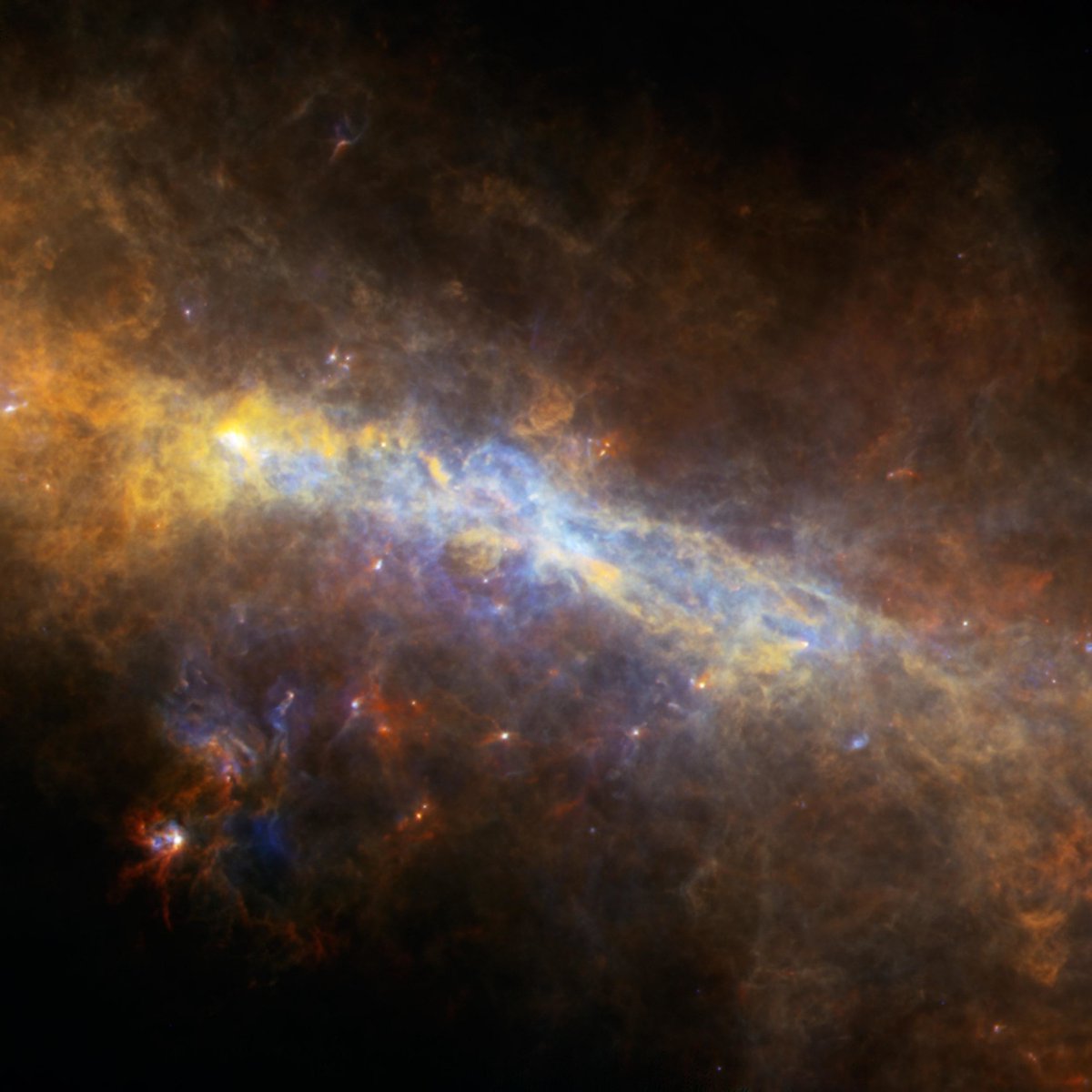 The European Space Agency peered into the center of the Milky Way to capture this image in the far infrared spectrum. The galactic core—glowing mostly in yellow—is 30,000 light years away, so what you see took 30,000 years to reach the ESA's telescope. wired.trib.al/Fv2dvWz