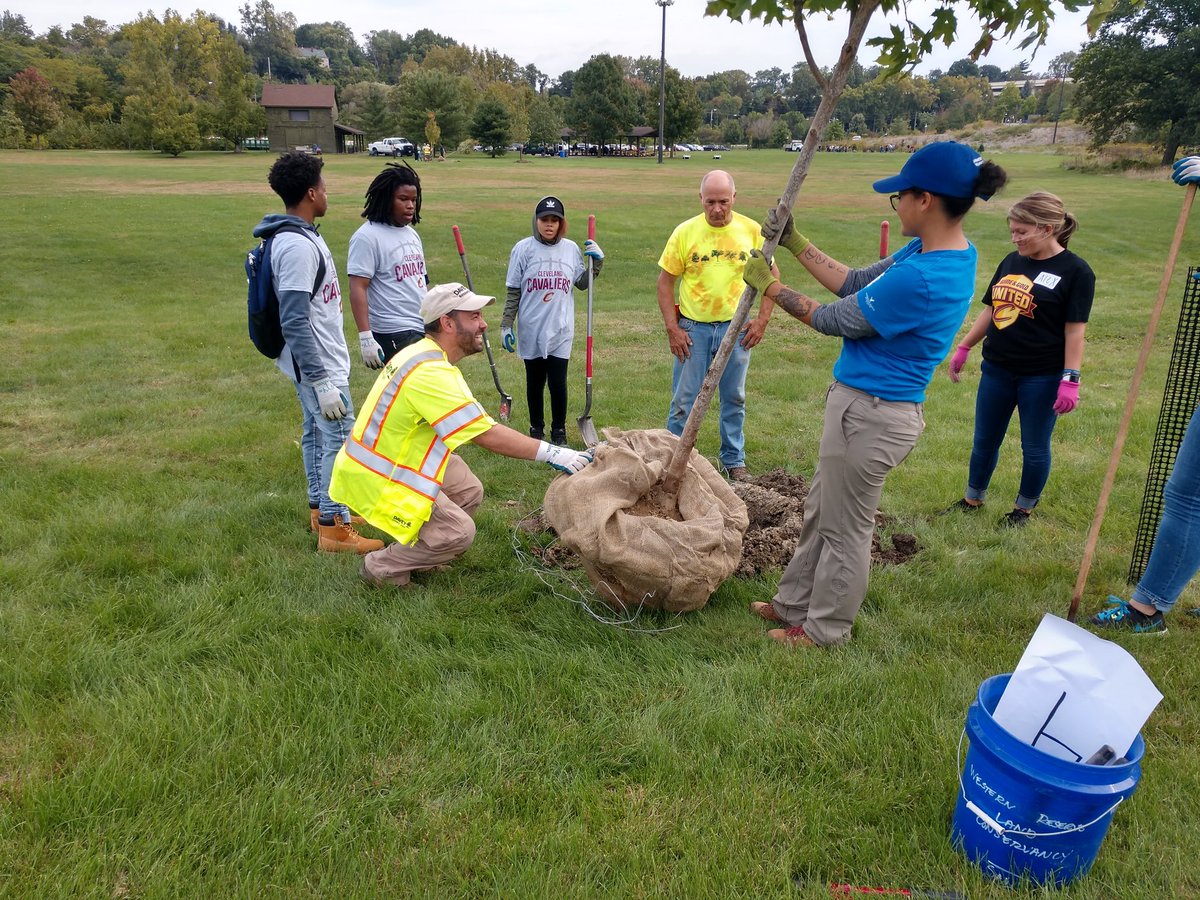 DaveyTree's tweet photo. In the late 1800s #CLE was nicknamed The Forest City. #CLE tree cover currently provides $28M in annual services. The #trees4threes planted today support the Cleveland Tree Plan. @Cavs #TeamPwC #CLETrees https://t.co/hoVCYLFBAa