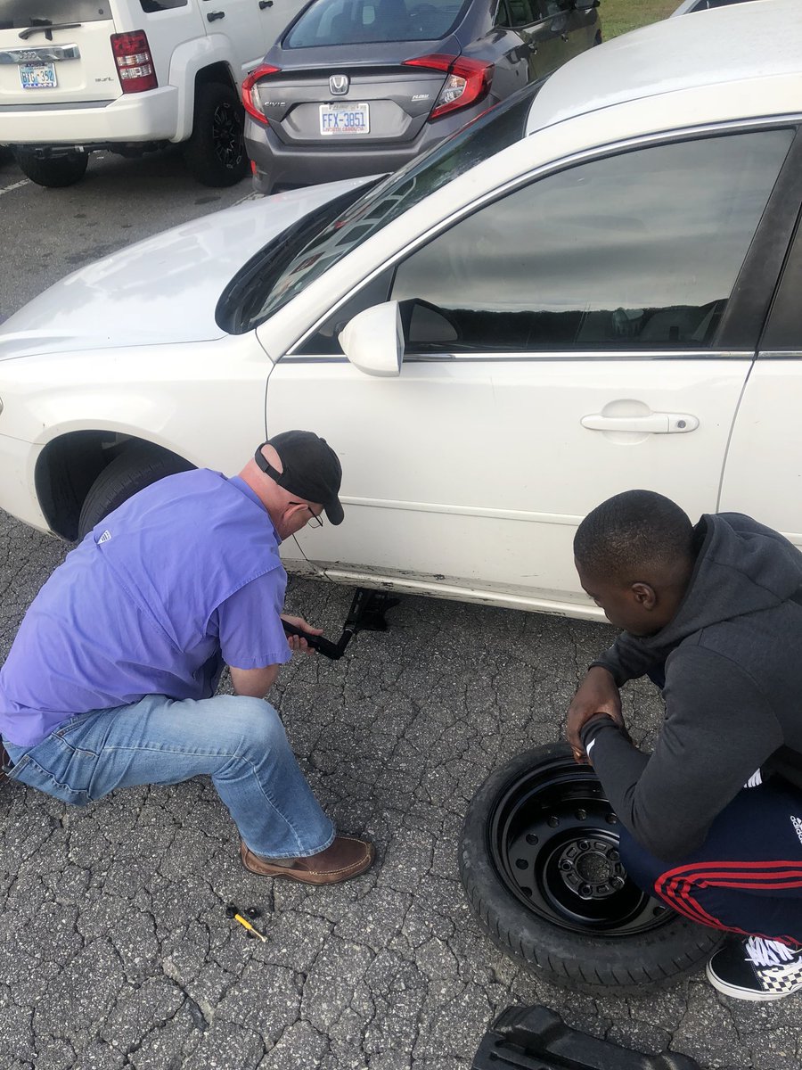 Marvin__Who's tweet photo. Definition of a head coach!! 9:30 in the morning helping one of his players change their tire #realman https://t.co/uy3ltg3f88