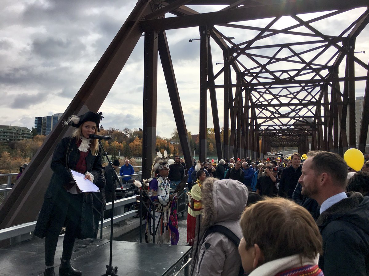 hilaryYXE's tweet photo. Bridge opening #2 today at the #trafficbridge. Some history of the bridging between Nutana and Saskatoon in 1907 was shared by the town cryer & lots were out celebrating the history and improved transportation for all starting this week in #yxe! 🚲🛴🚙 🚶🏽♂️🏃🏾♀️ https://t.co/On4nye3h22