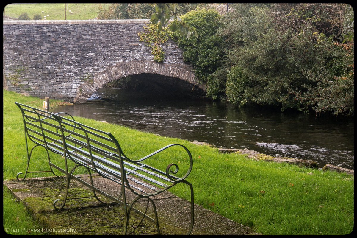 Ian_P_photo's tweet photo. Day 275. Bench with a view. Another in my occasional series of Bridges of Cumbria. Can imagine sitting here watching the river π#365photochallenge #day275 #northwestuk #cumbria #NotJustLakes #LakeDistrict #bridge #RiverCrake #bench #iPhone7Plus #Benchwithaview @VisitEngland https://t.co/7AUKBUbIsL