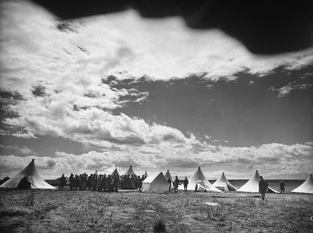 syria_throwback's tweet photo. French Foreign Legion soldiers gather around newly erected tents as they set up their outpost near #Homs, Syria, 1940.
PC: Margaret Bourke-White https://t.co/wnkmix96OU
