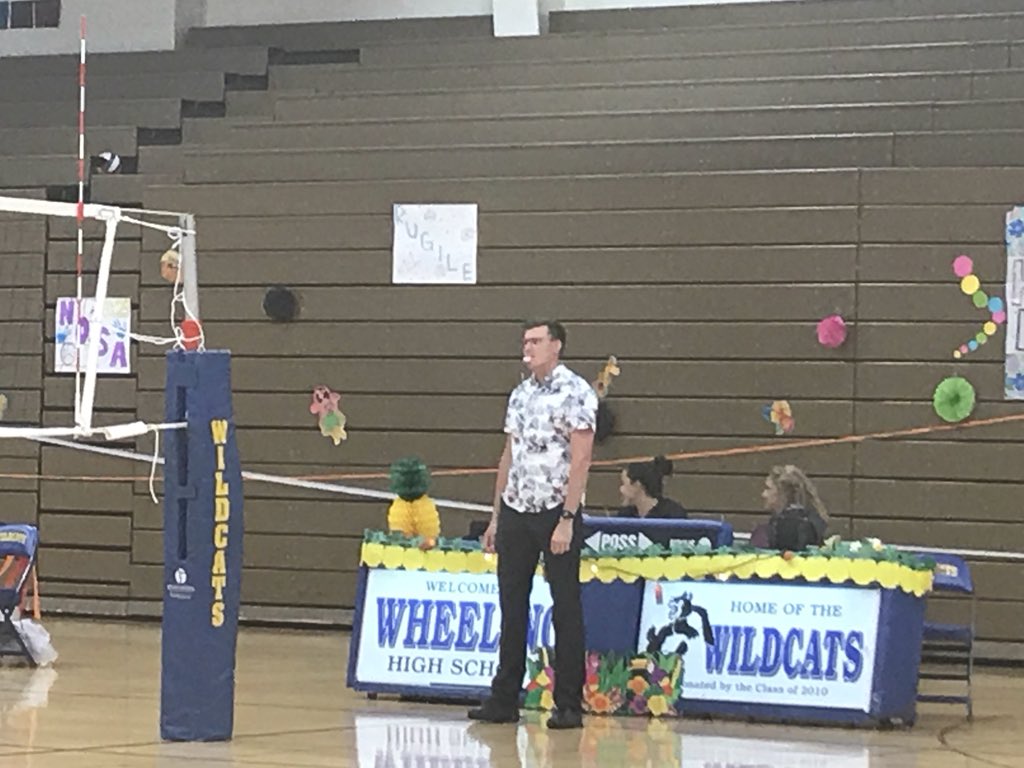 lead4change5's tweet image. Took me a minute before I realized that the refs were participating in the theme too. #hawaiiannight @WHS_Cat_Pack @WHSactivities @Wheeling_Cats