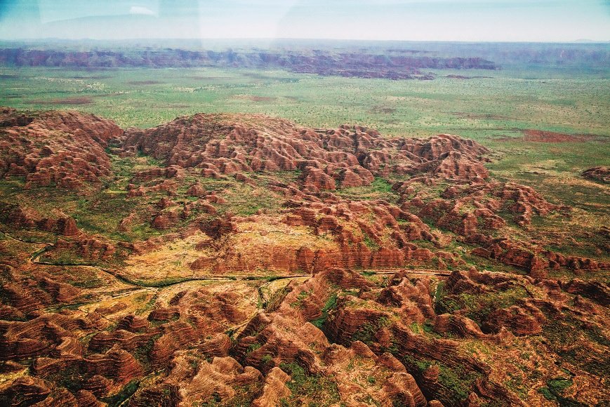 Witness the awe-inspiring panoramic views of the Bungle Bungle Range of The Kimberley region in Western Australia from above. The World Heritage listed site is truly one of the most fascinating geological landmarks in the world. #bunglebunglerange #aatkings #smilekings