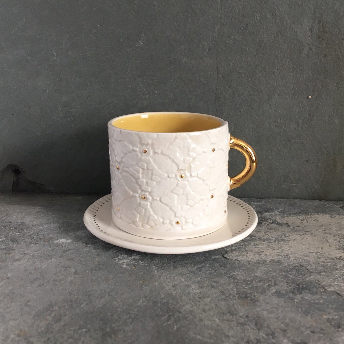 fspiceceramics's tweet photo. Two espresso cups made it, one didn’t, the glaze was too thick. They need a bit of tweaking but quite pleased with them so far #handmade #ceramics #pottery #espressocup #white #yellow #gold #independantmaker https://t.co/ER77aOUK0Q