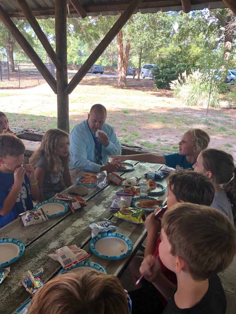 EllenWoodside's tweet photo. Students from K-5th grade who had 3 stamps on their summer reading passport were treated to lunch with Mr. McCain and a day at the Simpsonville City Park. The students had a wonderful time playing and having a pizza lunch! Great job readers! #ewewearefamily https://t.co/4YfBtlq8G7