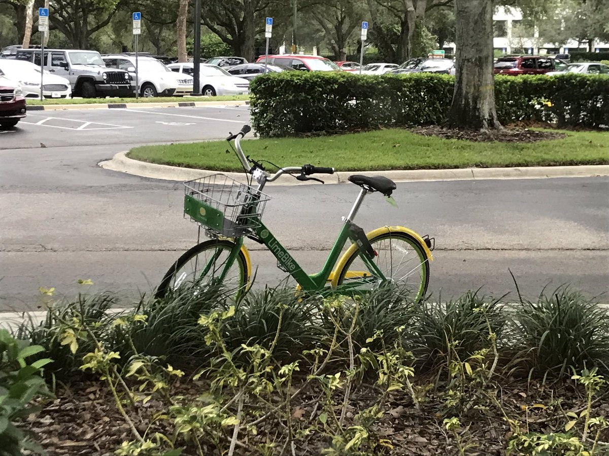 This <a href="/limebike/">Lime</a> has been sitting outside my office on the sidewalk for 4 hours. I see them ditched all over the UCF area. I understand someone is supposed to come by and pick them up. Convenience or clutter?