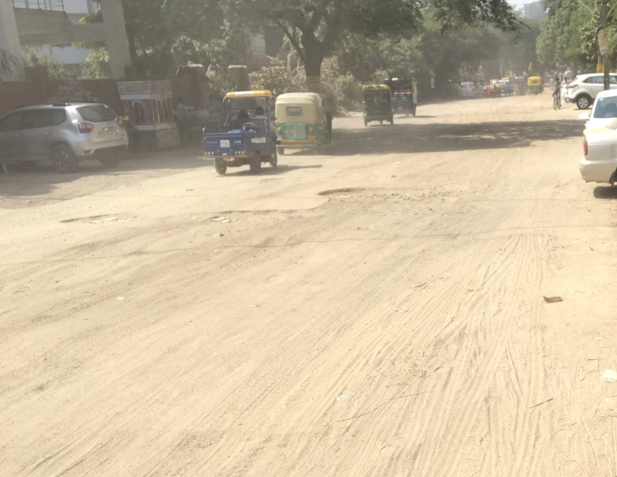 wecares4india's tweet photo. #selfiewithpotholes #deathtrap Let’s post selfie with potholes &amp; raise our voice. Road near DPSG Palam Vihar. @MunCorpGurugram @CommissionerMCG @cmohry @PMOIndia @yashpalmurar @RaoNarbir Sir we r waiting 4 road, Road is not even visible. I nominate @wrwre @mohitgupt for next. https://t.co/F0I8Q2m5Vr