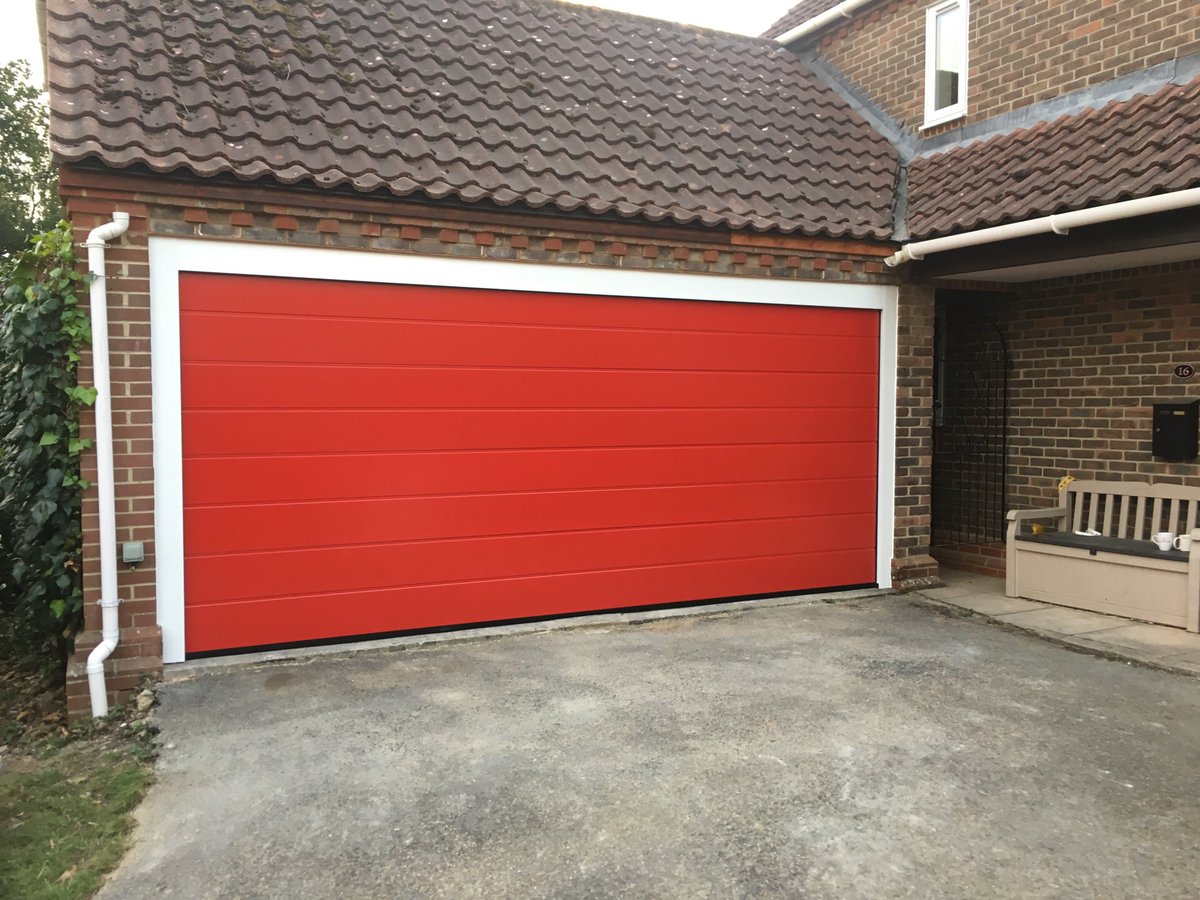 wolverinegarage's tweet photo. Here is a recent two into one installation we completed in #Curridge. Replacing two timber doors with one #Alutech M-Ribbed sectional door in Flame Red. #Garagedoors #Reading #Oxford# Berkshire https://t.co/xloVT6KZrf