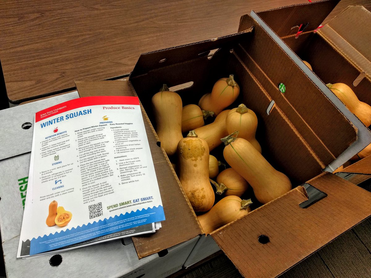 Several cases of honeynut winter squash headed to a partnering food pantry along with #spendsmarteatsmart publications. #mastergardener #growingtogether