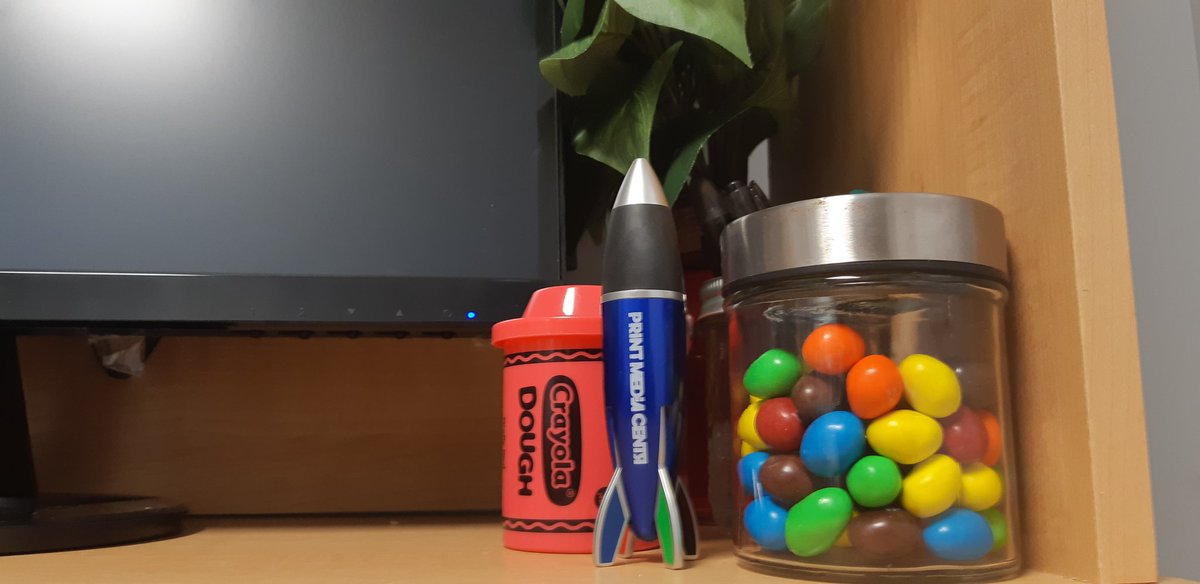 My new @PrintMediaCentr rocket pen fits right in with all my 'junk' that gets my creative juices flowing! #marketer #marketing #deskessentials