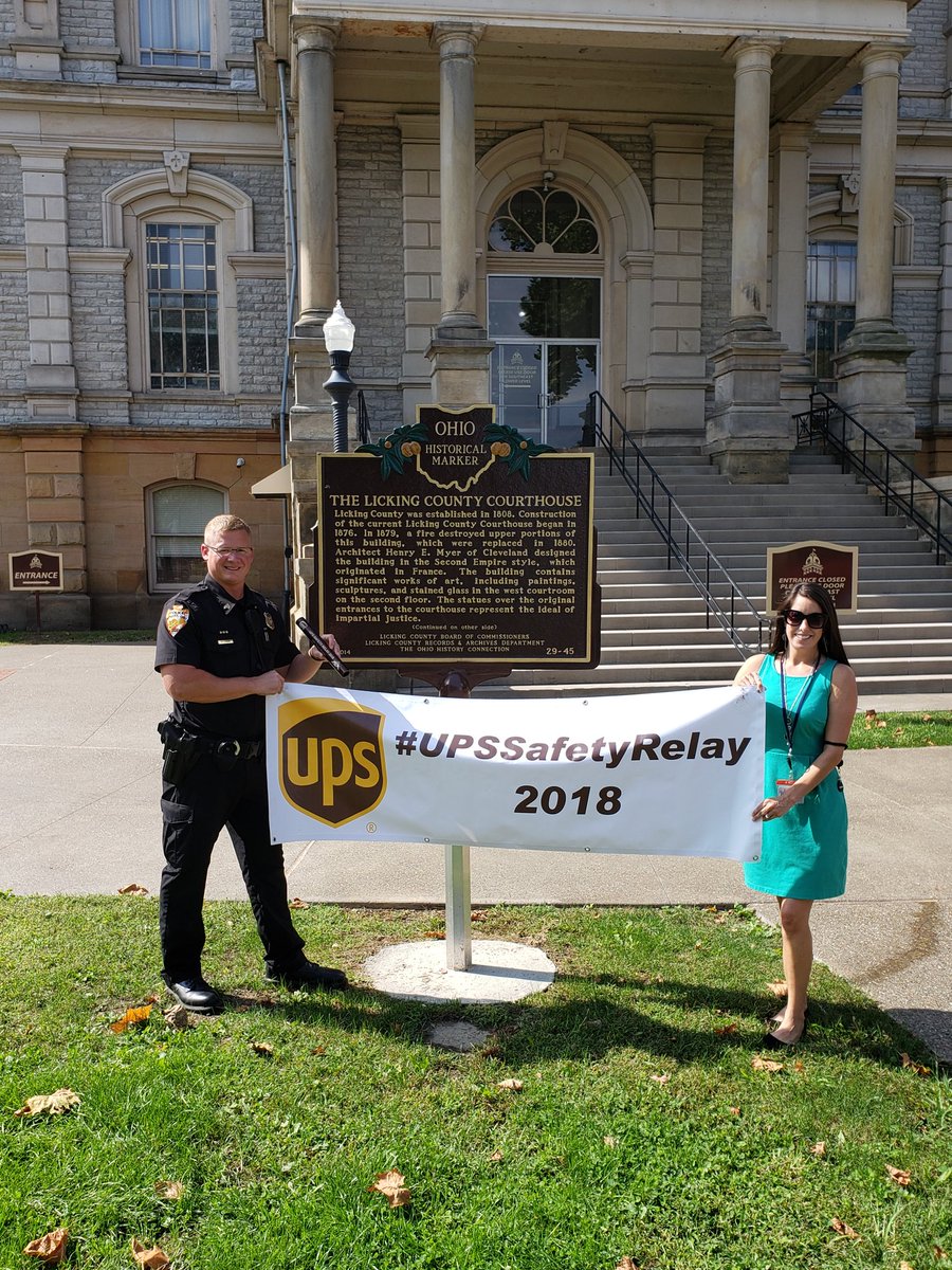 Thank you to <a href="/NewarkPD_OH_PIO/">Newark Police PIO</a> Sergeant Clint Eskins and his wife Adrienne for taking the time to have a picture with the #upssafetyrelay baton in front of the historic Licking County courthouse. Thank you to all law enforcement for making everyone else's safety your 1st priority!