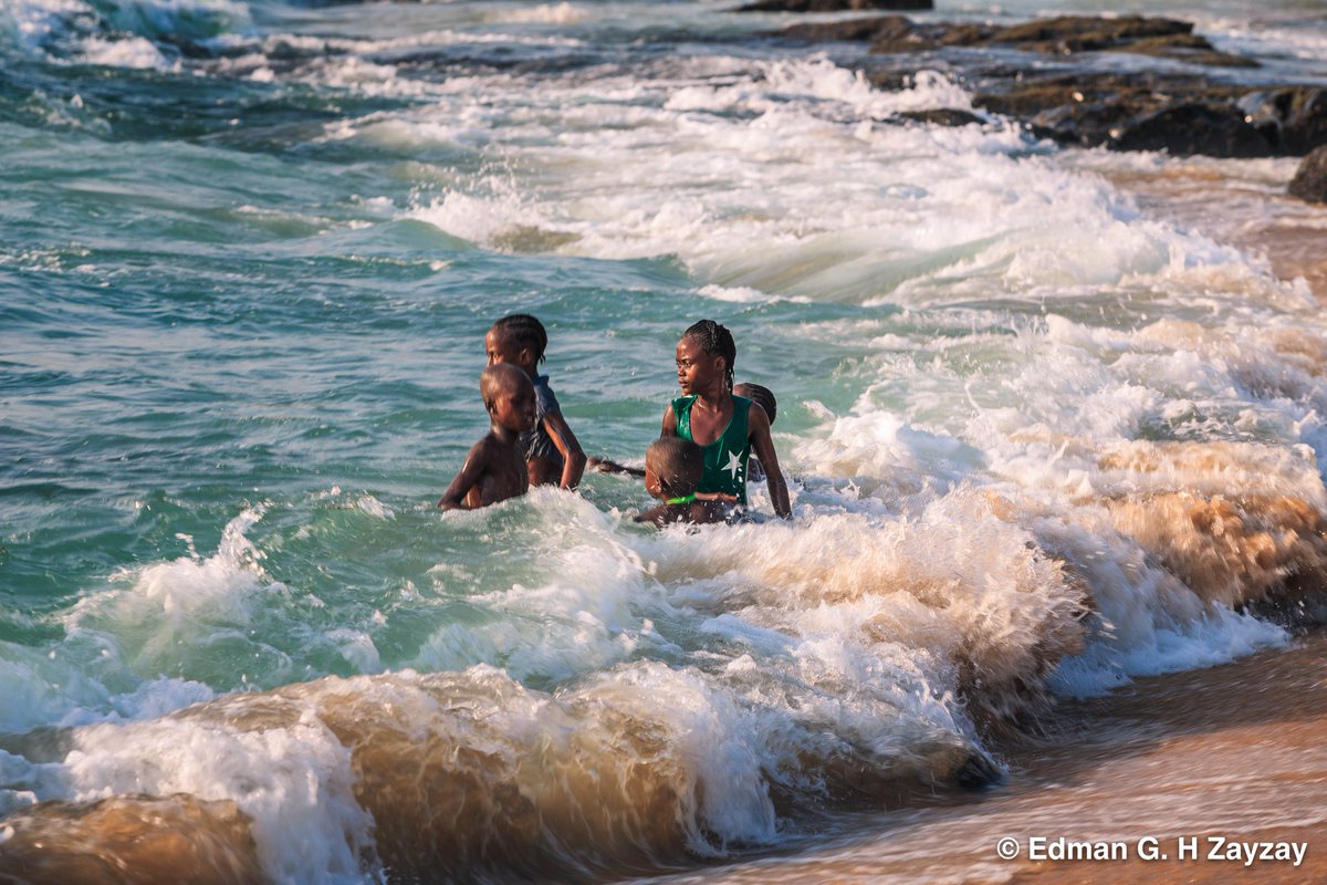 org4Liberia's tweet photo. Children swimming in the ocean in Liberia.  These kids were helping their parents sell fish on the beach. The parents could not afford to send them to school. https://t.co/rBLaBekMYW