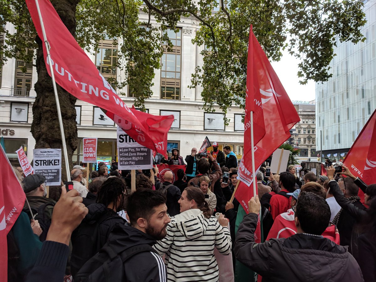 NotesFrom_Below's tweet photo. Picket line in Leicester Square outside McDonald's. Speakers from France, Chile, and the USA talking now #FFS410 #McStrike https://t.co/X0pqs6GIG8