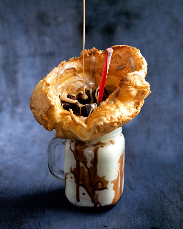 BhamUpdates's tweet photo. Our favourite element of a roast dinner is now living up to its name. The Yorkshire Pudding Freakshake from Toby Carvery features ice cream, nutty sauce, brownie pieces, cream, and a GIANT Yorkie Pud placed on top to finish. (Image: Toby Carvery) https://t.co/ercdjmV3Bj