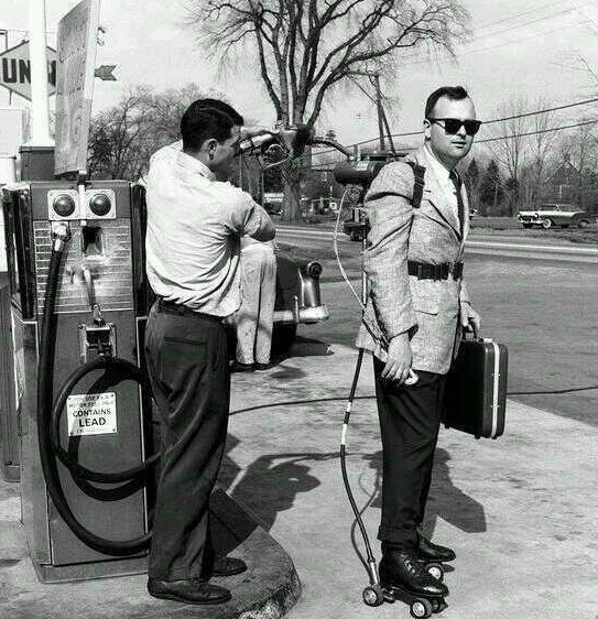 HistoryInPics's tweet photo. A salesman has his motorized roller skates refueled. Connecticut, 1961 https://t.co/8CdO1fto2y