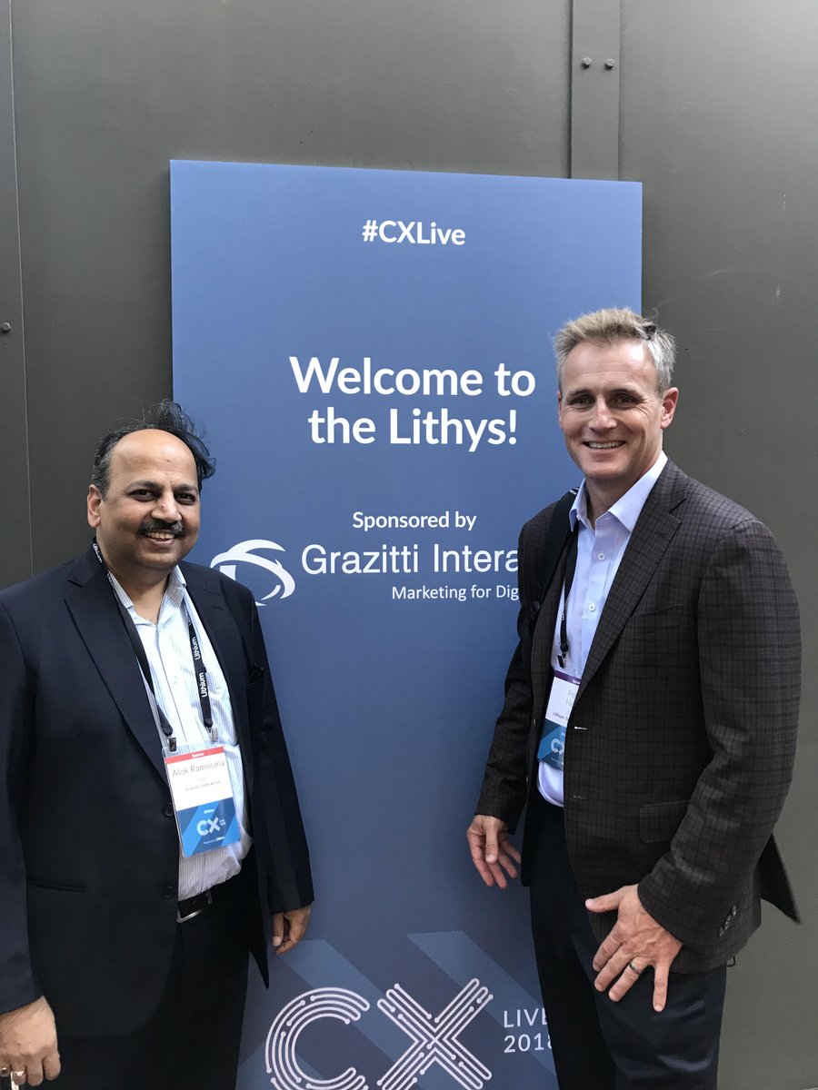 Grazitti's tweet photo. Grazitti's CEO, @alokram, and Lithium Technologies' CEO, @hess_peter go all smiles, posing together for a picture as they meet and greet each other at #CXLive 2018 @LithiumTech #Lithy https://t.co/ok6PXWwsBy