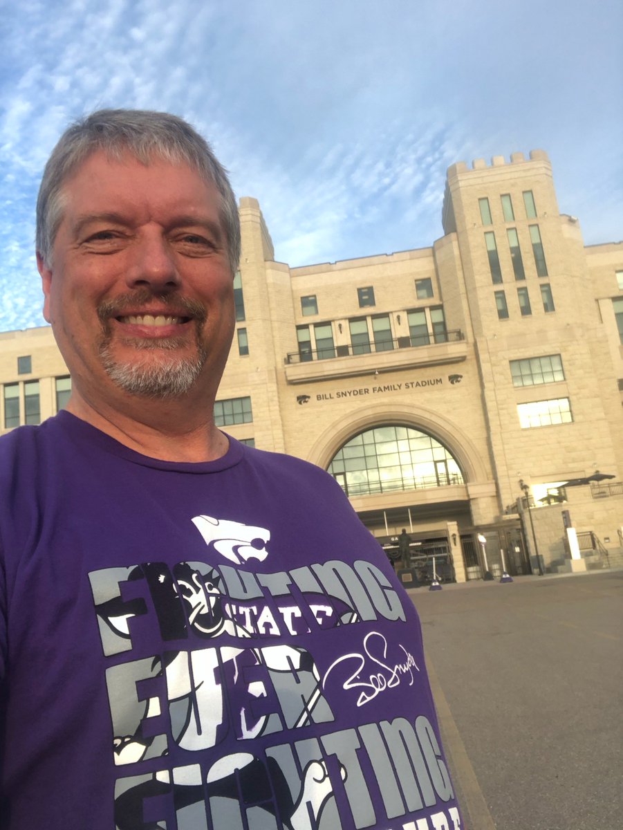 K-State Football &amp; Men's Basketball Public Address Announcer <a href="/davelewislive/">Dave Lewis</a>, a member of our advisory council, does so much to #HelpKStateFightCancer. Here, he shows his #KState pride w/ a Fighting for a Cure shirt. Get yours for Oct. 13! Info: cancer.k-state.edu/newsevents/Fig…