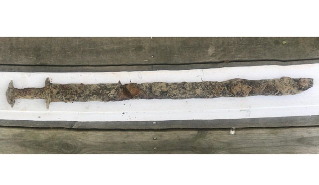 motherboard's tweet photo. An 8-year-old Swedish girl pulled an ancient Viking sword from a lake, which makes her our new ruler https://t.co/mtcsIXSxqO https://t.co/ONWMEvCzuF