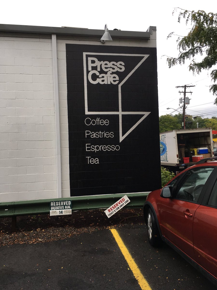 From 12 story tall buildings to 12 foot deep buildings. 

This might be my favorite building in Ithaca. Tiny, simple, but screens a parking lot, creates a lovely courtyard, and provides much better coffee than the conference 😉☕️

Also, cool signage. #upstateapa18