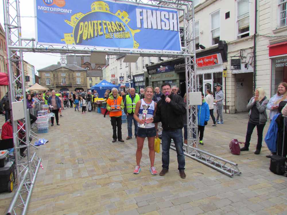 PonteHalfand10k's tweet photo. Our Pontefract Half 2018 winners! First male and female over the finish lines - Daniel Franks and Rebecca Winter. Well done! #pontehalf #winners @RidingsFM @motorpoint @Charlstons_reno https://t.co/hk9Ara2tRG