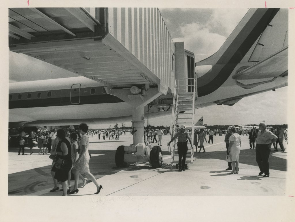 JAXairport's tweet photo. #TBT to crowds of people enjoying the static displays on the ramp at the opening of the Jacksonville International Airport. #jaxairport #throwbackthursday #jax50 Photo credit: Times Union https://t.co/3V1CrHQBwW