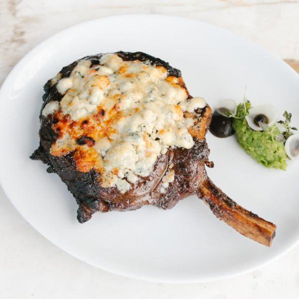 Here's our Cowboy Ribeye topped with blue cheese!  Our sommelier would love to find your perfect pairing! ift.tt/2RsOT2E