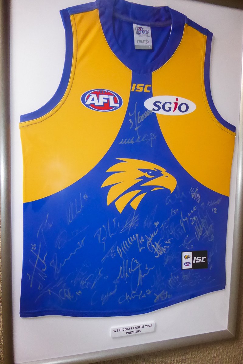 TimorLVision's tweet photo. @conocophillips 2018 signed West Coast Eagles Team Home Guernsey online auction for TLV. Includes a Certificate of Authenticity. We are a Perth based charity working in East Timor. Check out the link here: https://t.co/eVOWcklzGQ …W: https://t.co/dW7WXSSROF  E: info@tlv.org.au https://t.co/KnG2XBDJTW
