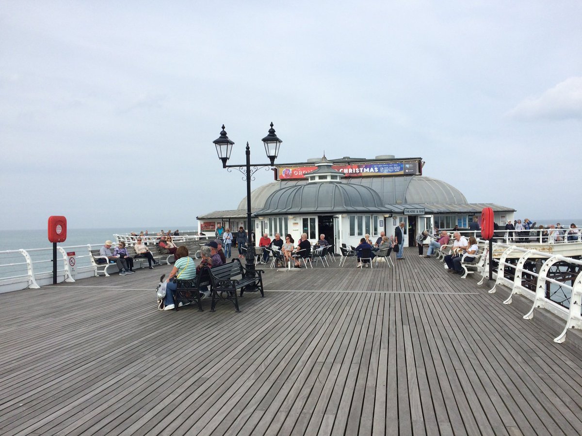 DBaleReporter's tweet image. People are flocking back onto Cromer pier after it was closed for filming.