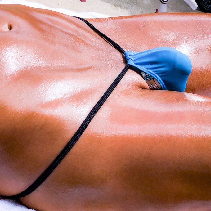 Laying out in a micro thong, showing off my shiny cockrings! Come joins me at https://t.co/wVBOskV5Dq
