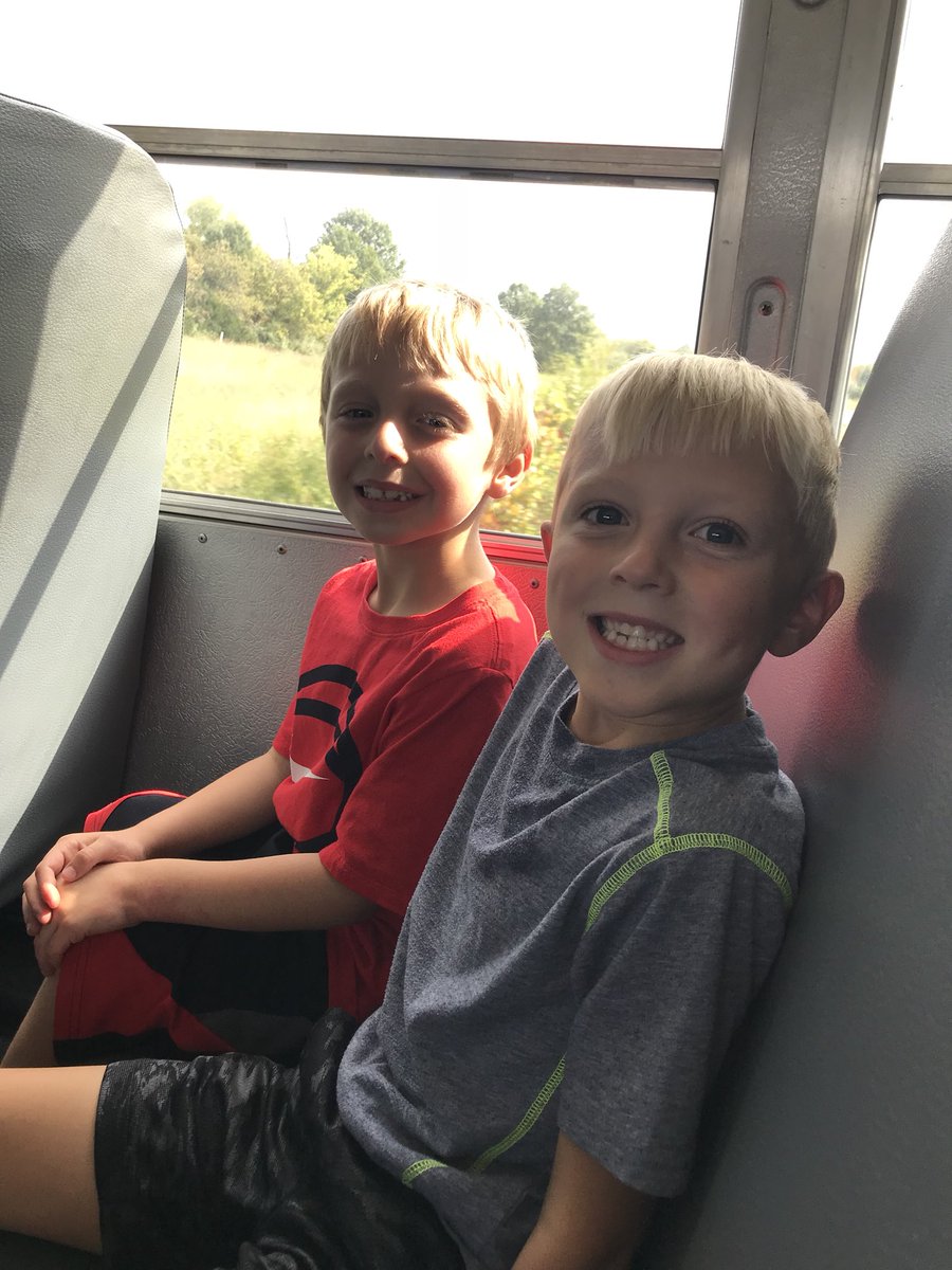 All smiles on the bus ride headed for the pumpkin patch! We can’t wait! 🎃