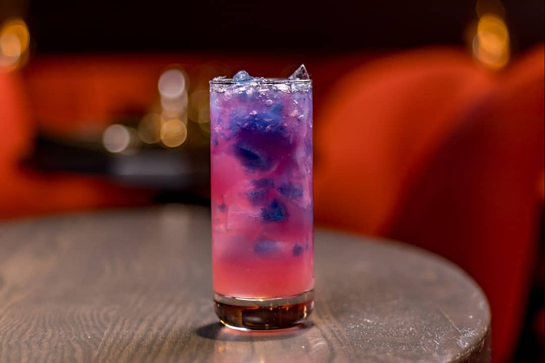 #FinallyFriday Try the Witch-A-Rita 🧙‍♀️ A bewildering spiced pomegranate and tequila concoction that changes from pink to blue and finally purple right before your eyes! | RSVP @ motifjazzcafe.com/reservations ••• #coloradosprings #colorado #motif #jazz #motifjazzcafe #cocktail