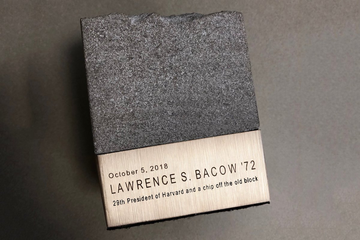 MIT's tweet photo. A gift presented to @Harvard President Larry Bacow by MIT President L. Rafael Reif: a piece of limestone from the original MIT Dome. “A little something to remind you of home.” Congratulations, Larry! https://t.co/hQl4EMP49R
