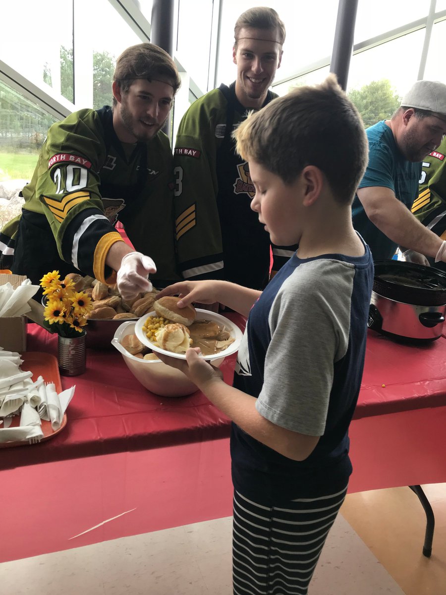 OHLBattalion's tweet photo. Hairnets = 👌

Battalion players @p_schlueting19, @Henderson_08 and Cole Cameron were at St. Theresa Catholic Elementary School in Callander today handing out programs and helping out with their annual Thanksgiving turkey lunch! https://t.co/UVv0lPhN2j