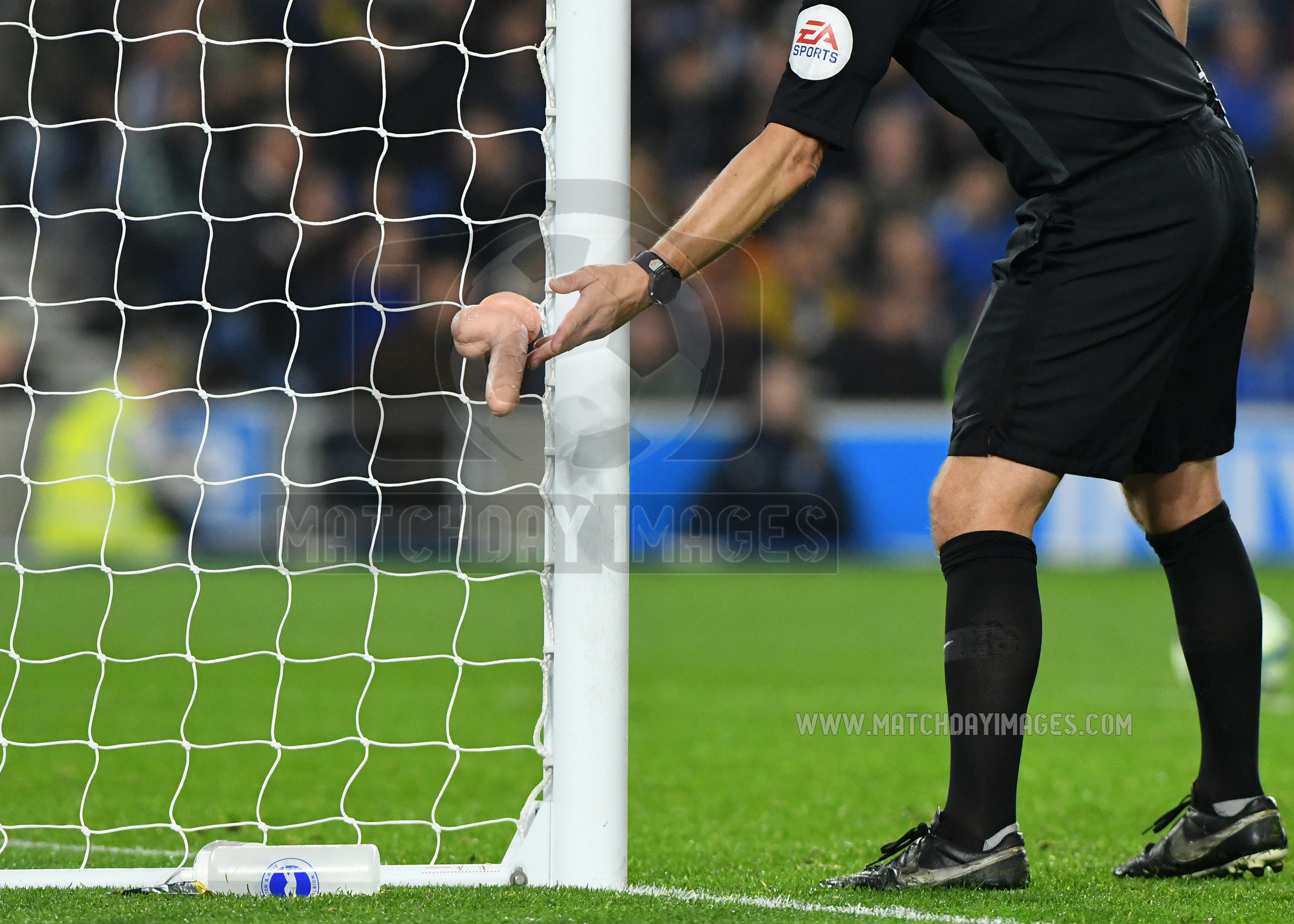 Mark Enfield Photo on X: "Strange the things people take to football  nowadays. Referee Kevin Friend removes 'an object' thrown onto the pitch  during the Brighton West Ham match #Brighton #WestHam #sextoys