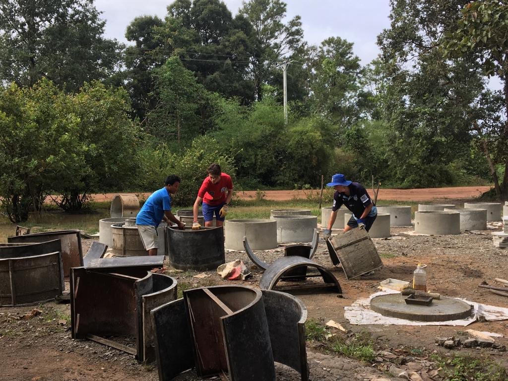 CampCambodia's tweet photo. Kids #TeamIndree make concrete pipes at camp Beng Pae #CampCambodia for building the village wells and toilets @campsintaus @CampsInt https://t.co/67lFXuQdCm