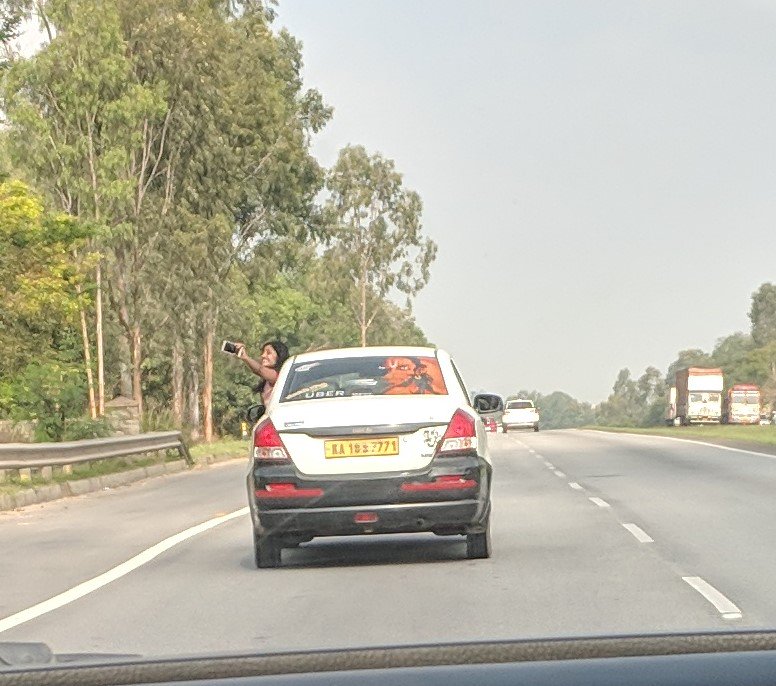 nramesh's tweet photo. Doing this while moving at 100km/hr on a highway!! #generationselfie https://t.co/6sQW8BJIAi