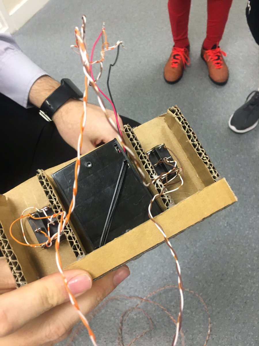 SJCRobotics's tweet photo. Lower school robotics club start building a cardboard robot this week. Two motors wired into two tilt switches. @SJCRobotics @SJCSouthsea #edutech https://t.co/qFUa22Uxow