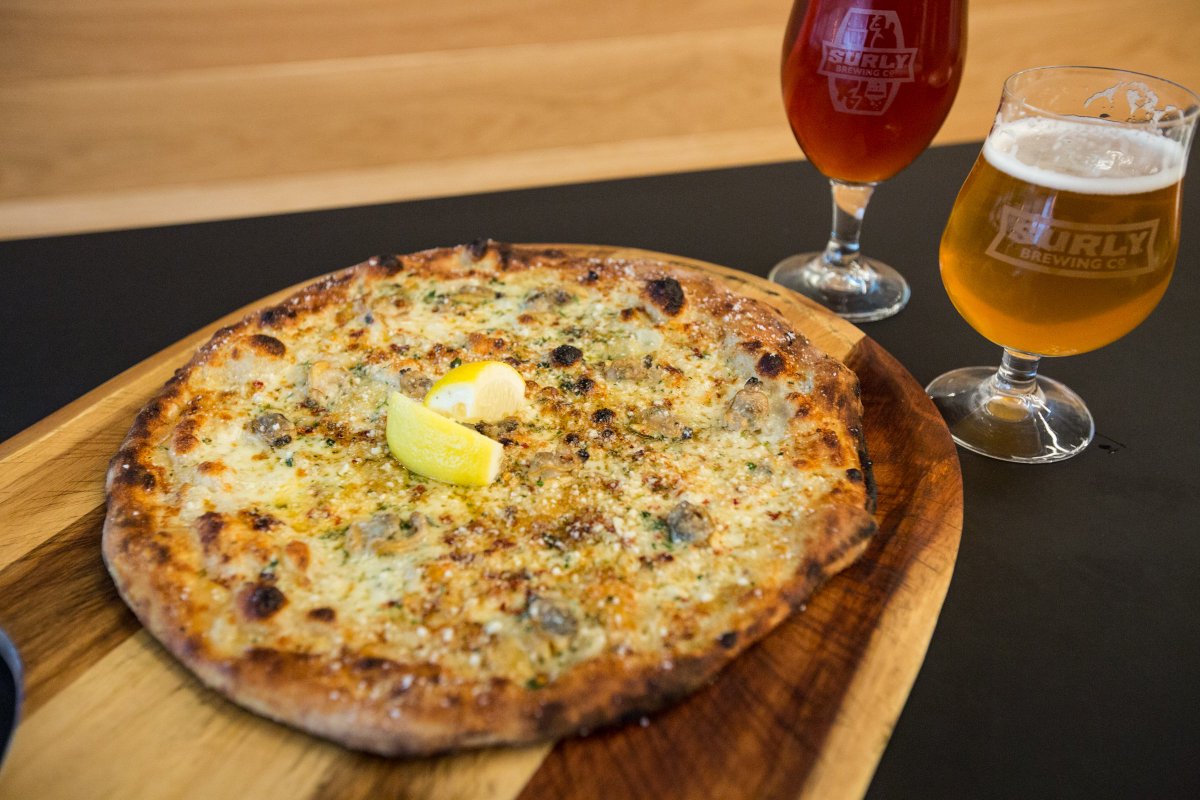 surlybrewing's tweet photo. We recognize #NationalSeafoodMonth at Surly Pizza Upstairs, too. The Pioneer Hitchhiker is our spin on a classic New Haven pizza, using fresh Manila clams steamed in wine and marinated in cooking wine and olive oil. #SmartCatchMN https://t.co/f7d8390fRR https://t.co/IqgeDW0a0l