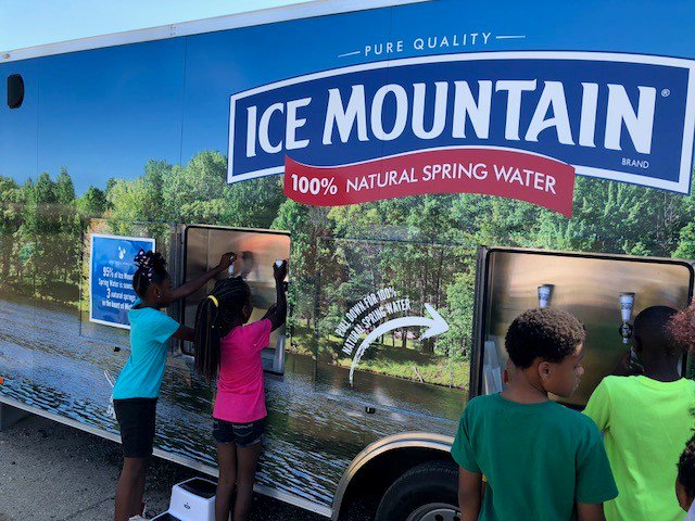 NestleWatersNA's tweet photo. Mobile hydration stations are just one way we're delivering on-the-go hydration to local communities. These trailers full of water visit various events to enable community members to fill their cups or reusable bottles with complimentary water. @PolandSpringWtr @IceMountainWtr https://t.co/u0TYQWDVnP