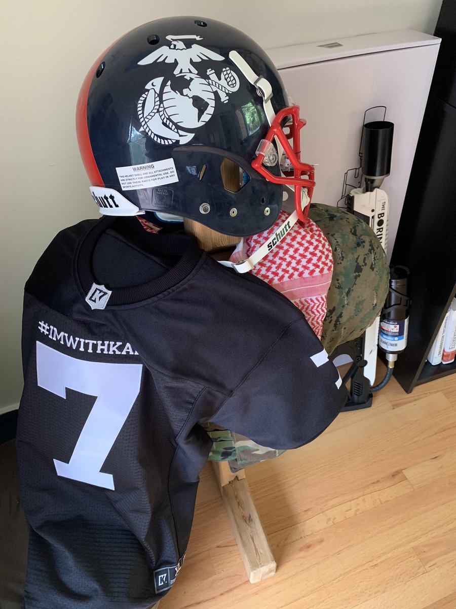 AdamForce_1's tweet photo. Some of my favorite things: @boringcompany #notaflamethrower, the helmet I deployed with to Afghanistan, a helmet from the Marine Bowl, and new today, limited edition #ImWithKap jersey. #vetsforkap #USMC @Kaepernick7 @Nike @BLMNational #allyship #equalityally https://t.co/kH7CUD7XT3