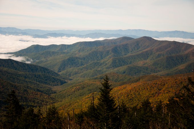 Mountain views showing some yellows and reds with clouds in the distance. Taken by Jessie Snow.