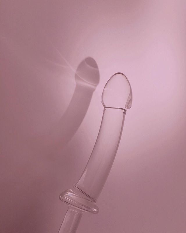 sun bathing 🌸 today just needed more ethereal #dildodreamland
.
[photograph of a clear glass dildo against a plain wall with visible shadow, everything is a soft pink color] ift.tt/2Ak6RxH