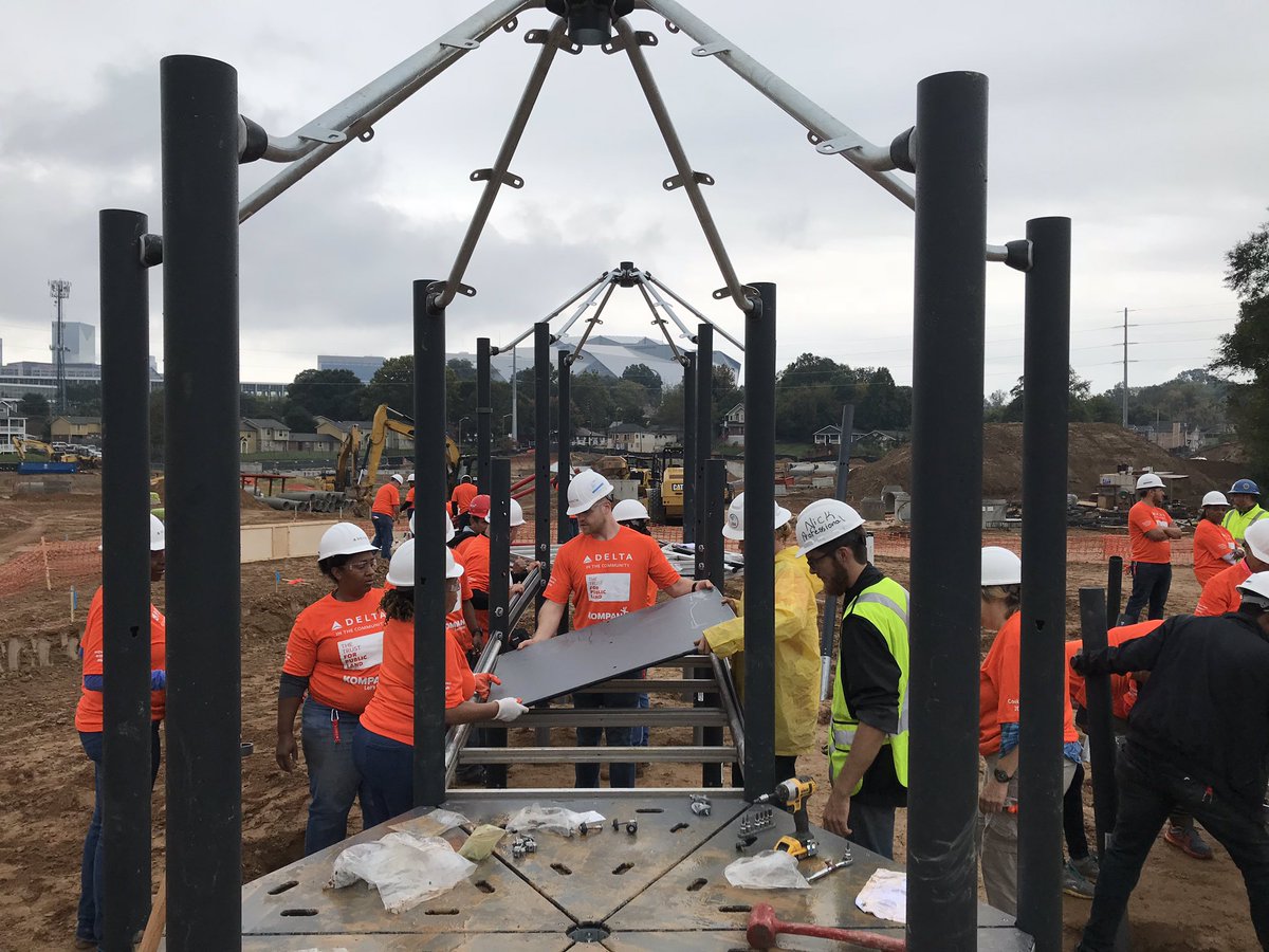 75 <a href="/Delta/">Delta</a> employees building the Kompan playground @ Cook Park w/ <a href="/MBStadium/">Mercedes-Benz Stadium</a> in the background. Teamwork <a href="/tpl_org/">Trust for Public Land</a>. #DeltaServes #10minwalk #letsplay.