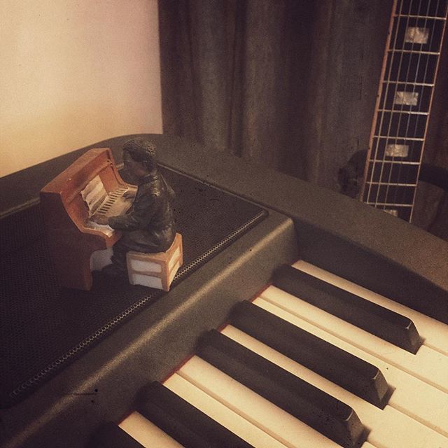 Piano man on a piano #piano #man #figurine #musician #acoustic #guitar #singer #mannequin #noose #instalife #livemusic #video #music #band #musicphotography #photo #redcamera #gigphotography #rock #taylor #slowmotionsuicide #awesome #gibson #335 #gig #merch #recursive