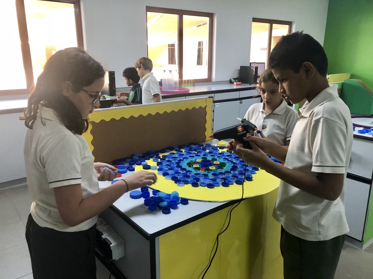 TraceyCroukamp's tweet photo. The GCS PYP eco-team showing their creative flair while designing a recycling bin for plastic bottles which will be recycled into clothing @dgradeclothing #simplybottles #mygcs #behappybegcs #taaleem #GCSecoschool https://t.co/4SO3zMXKHZ