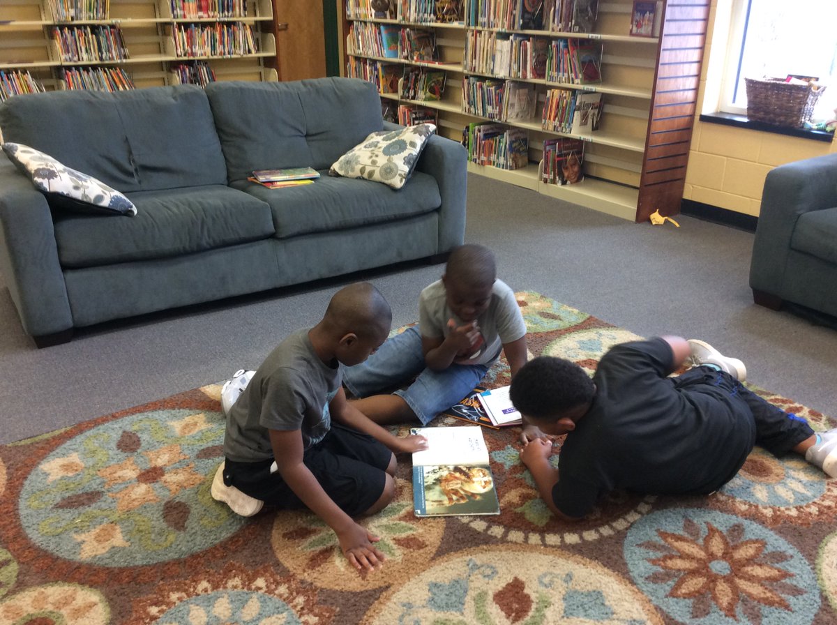 librarymbp's tweet photo. Mrs. Brezinski's class has earned the privilege of reading in the "comfy" area with couches, pillows, easy chairs, and soft rugs.  
#hcslibrarymedia  #mbelibrarylearningcommons  #seahawksread https://t.co/1IMir2MCmJ