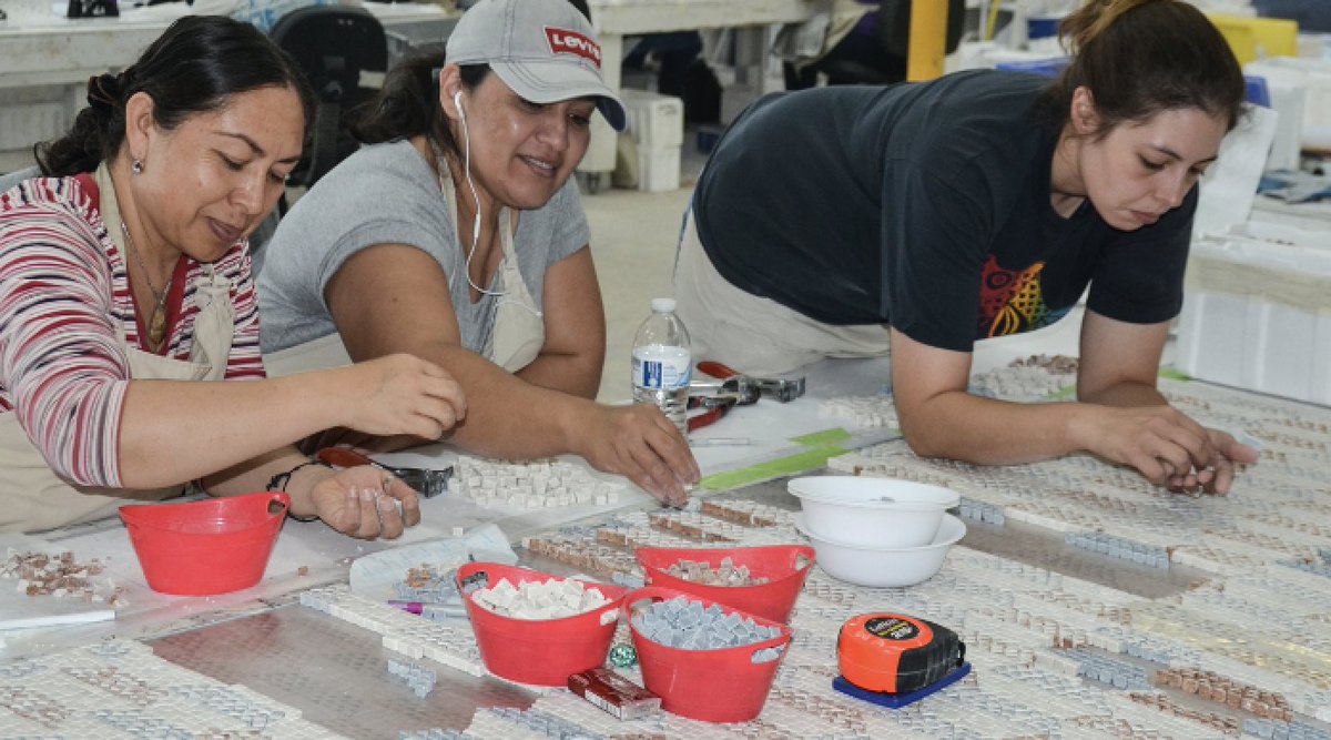 NewRavennaUSA's tweet photo. #teamworkmakesthedreamwork at #NewRavenna. At our factory, it is not uncommon to see many mosaicists working on one project simultaneously - it takes a lot of people (and patience!) to place all those tiny pieces of stone and glass by hand! https://t.co/fPEVtKlQzA