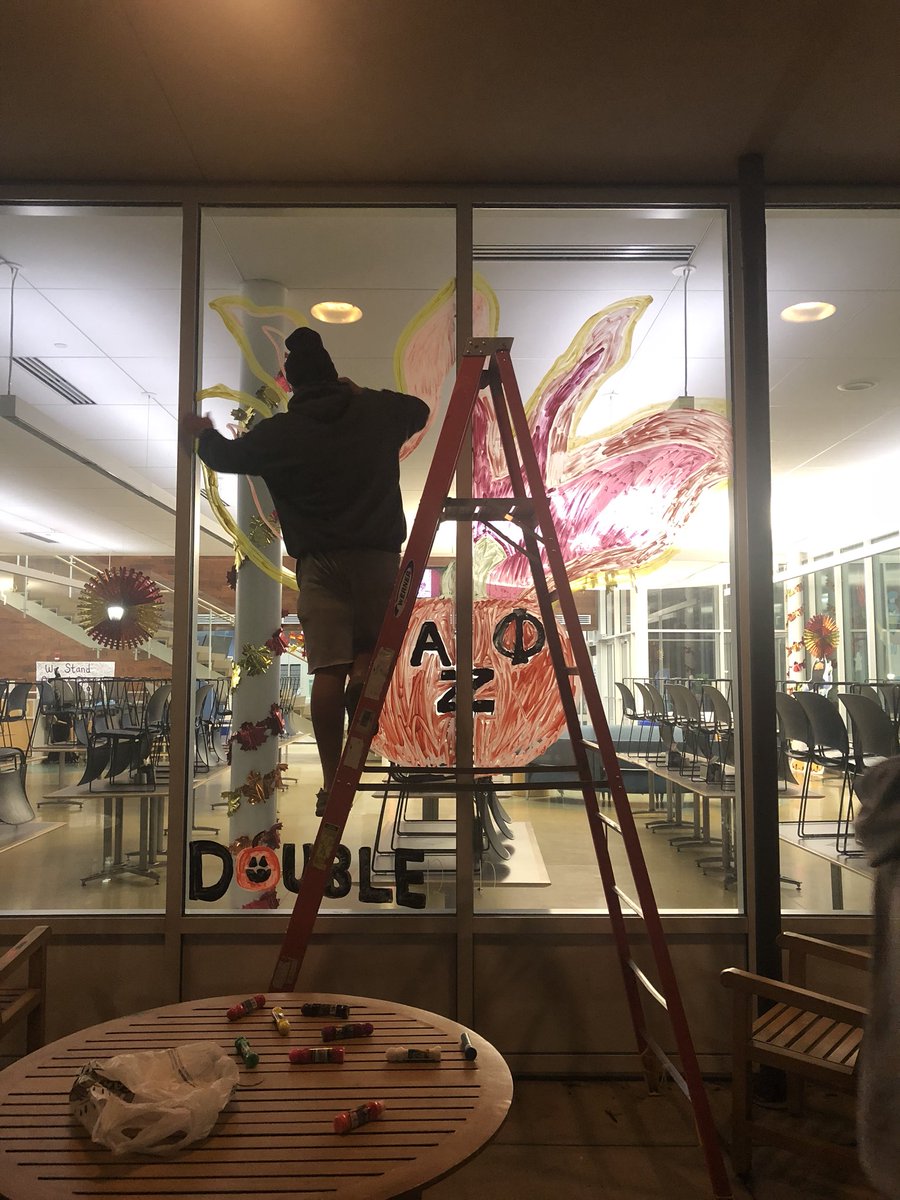 AZPuiu's tweet photo. Sophomores take over homecoming window painting for the “Peacock Pride Ignited... It’s Lit!” theme. https://t.co/GZkyyOxfPK